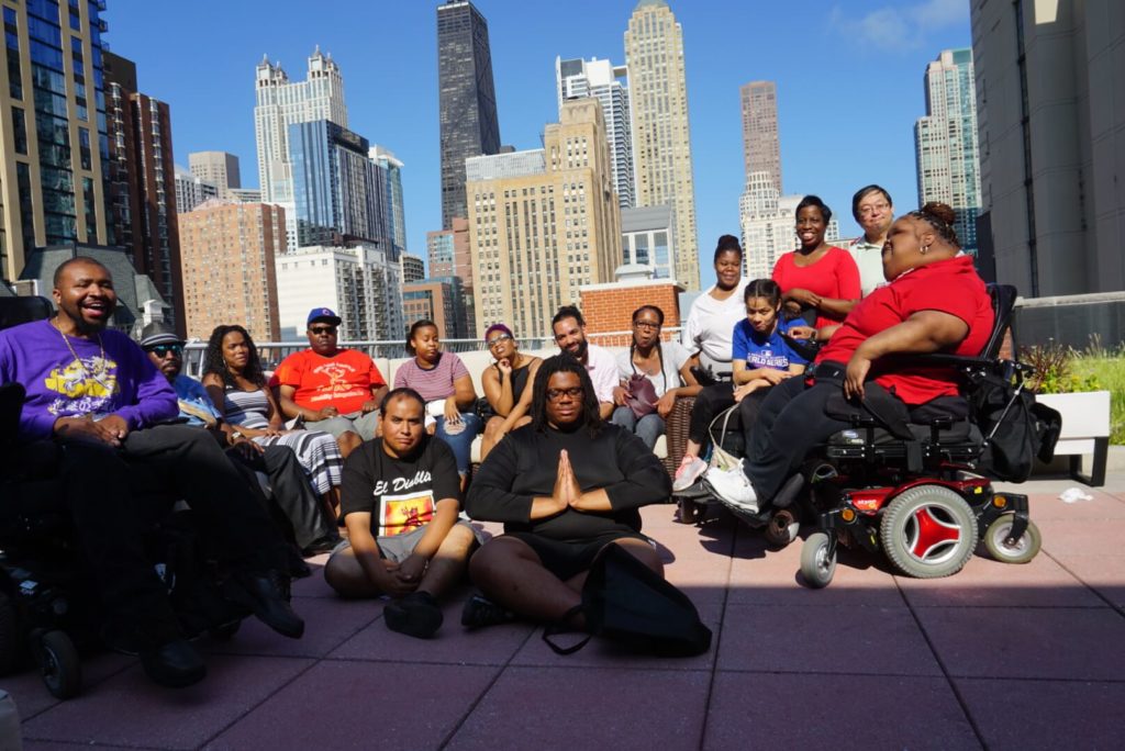 AYLP members pose for a group picture against the Chicago skyline.