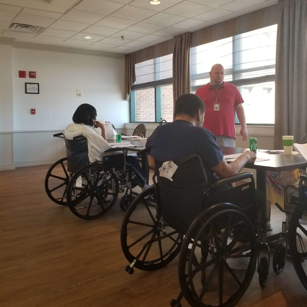 An Access Living instructor teaches nursing home residents about independent living skills.