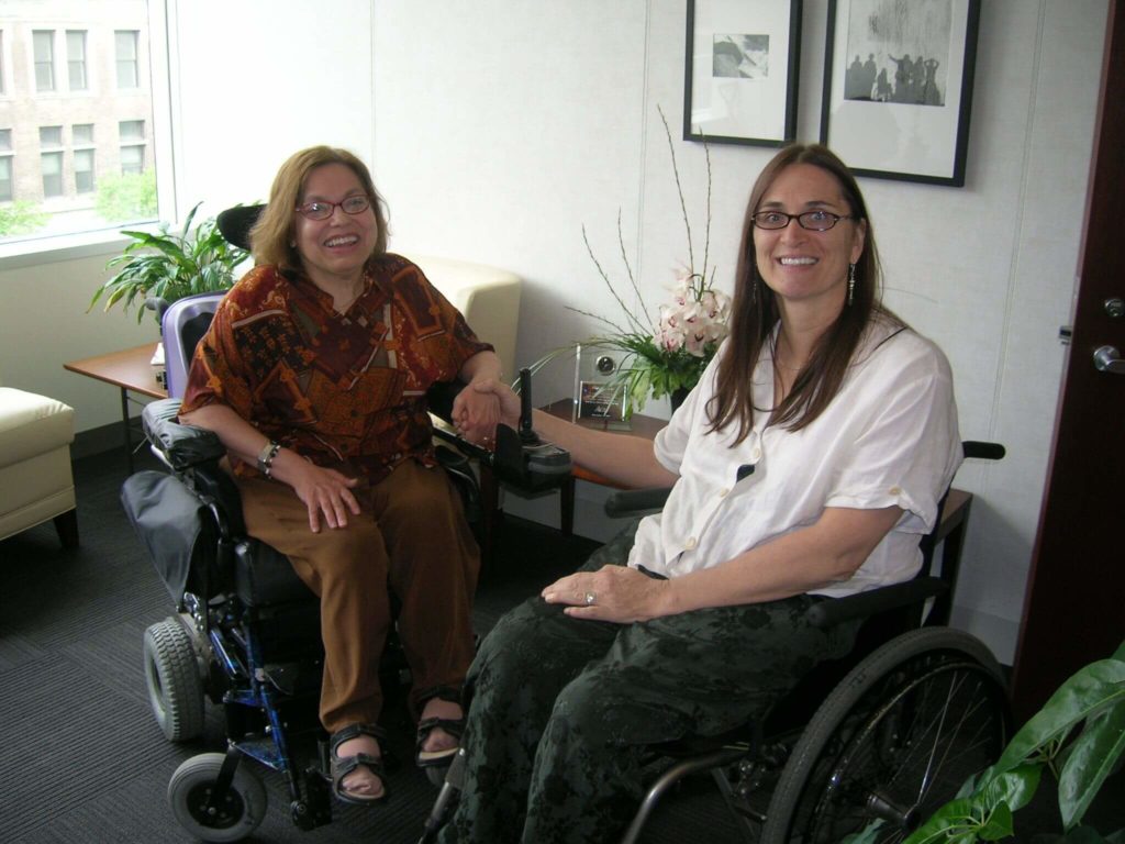 Picutre of Judy Heumann and Marca Bristo. Both are white women and wheelchair users.