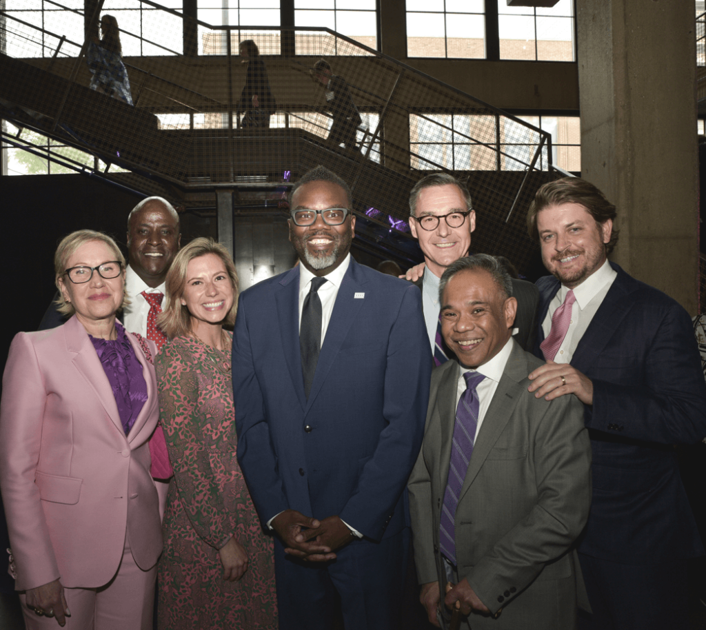 Chicago Mayor Brandon Johnson poses for a picture with members of Access Living's board of directors and the Gala Host Committee Chair Drew Beres.