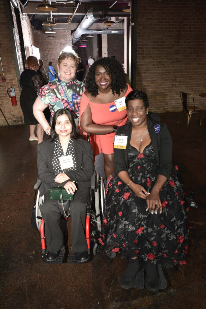 Group photo of Access Living staff members Amber Smock, Latricia Seye, Neelam Dhadankar, and Candace Coleman