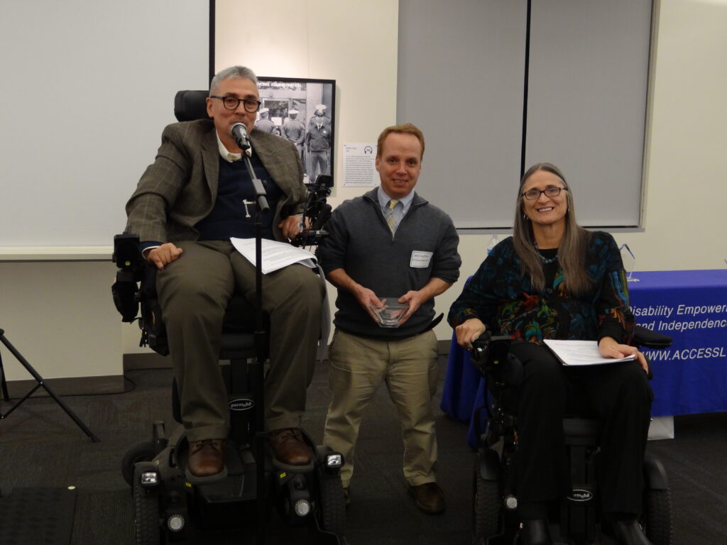 Andrés Gallegos with Marca Bristo and disability honoree.