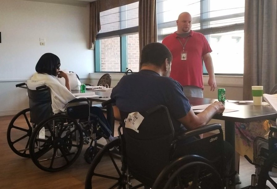 An Access Living instructor teaches nursing home residents about independent living skills.